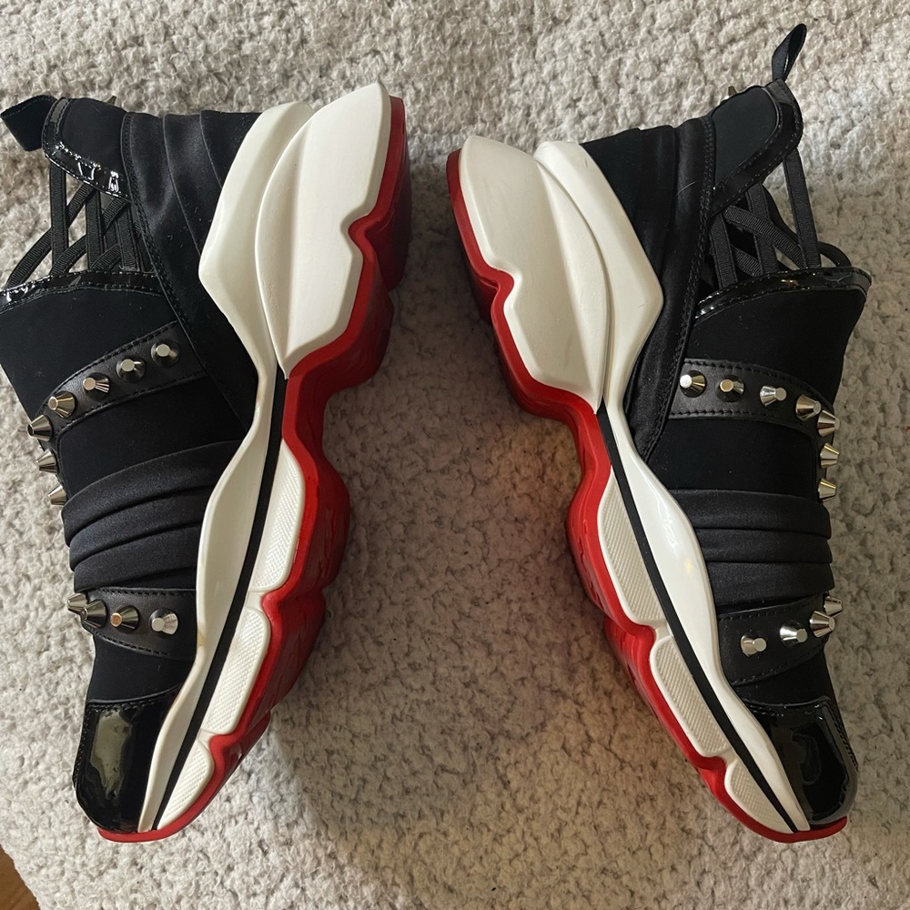 CL red bottom spike sneakers